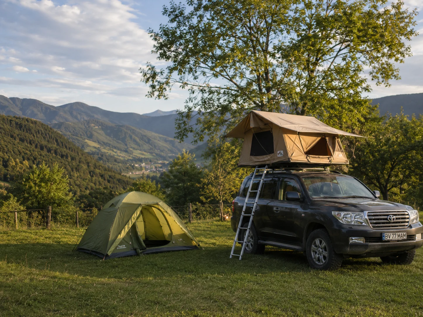 Roof tent on a car and a classic tent with valley views at Camping Be You Văleni